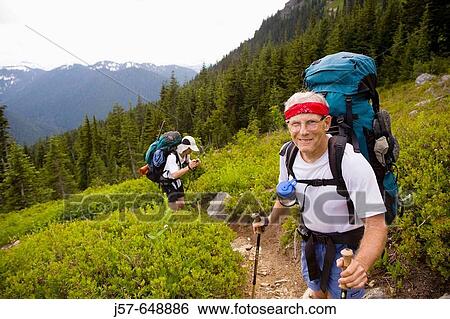 Hiking and climbing in Glacier Peak Wilderness. Washington USA. Happy to have cleared the trees and getting into the alpine meadows at white pass. View Large Photo Image Stock Photograph - Hiking and climbing in Glacier Peak Wilderness. Washington USA. Happy to have cleared the trees and getting into the alpine meadows at white pass.. Fotosearch
