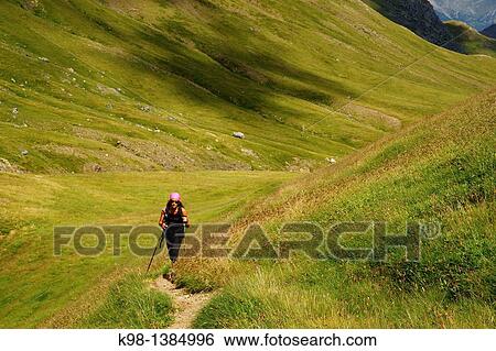 Stock Photograph - Hiking in the valley of the Pyrenees Mountains Ezcarra Huesca Pyrenees Spain. Fotosearch