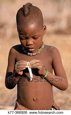 Himba boy. Kaokoveld. Namibia. View Large Photo Image Stock Photograph - Himba boy. Kaokoveld. Namibia.. Fotosearch