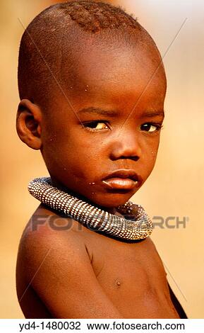 Himba boy, with the typical necklace, Kaokoland, Kunene region, Namibia View Large Photo Image Stock Image - Himba boy, with the typical necklace, Kaokoland, Kunene region, Namibia. Fotosearch