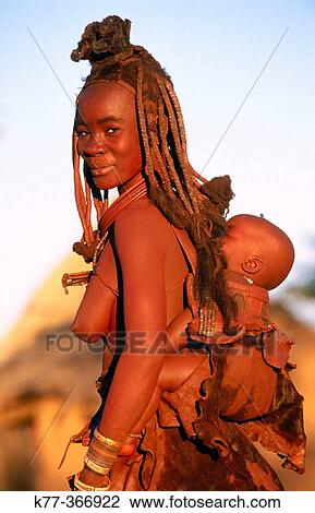 Himba wife with baby. Kaokoveld. Namibia. View Large Photo Image Stock Image - Himba wife with baby. Kaokoveld. Namibia.. Fotosearch