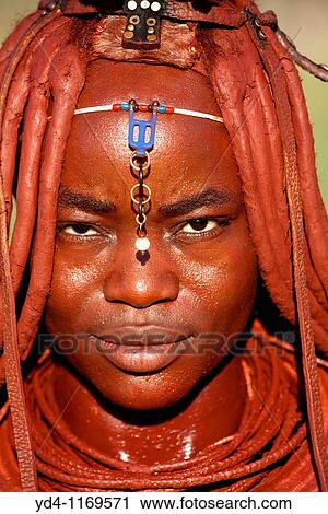 Himba woman with the typical ornaments, near to Epupa Falls, Kaokoland, Namibia View Large Photo Image Stock Image - Himba woman with the typical ornaments, near to Epupa Falls, Kaokoland, Namibia. Fotosearch