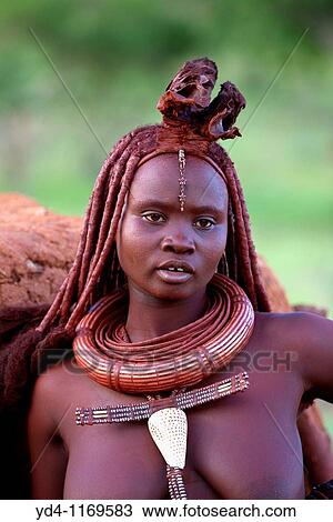 Himba woman with the typical ornaments, near to Epupa Falls, Kaokoland, Namibia View Large Photo Image Stock Image - Himba woman with the typical ornaments, near to Epupa Falls, Kaokoland, Namibia. Fotosearch