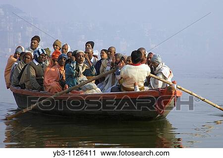 Hindu Pilgrims on a boat trip on the River Ganges, Varanasi, India View Large Photo Image Stock Image - Hindu Pilgrims on a boat trip on the River Ganges, Varanasi, India. Fotosearch