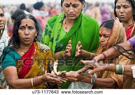 Hindu pilgrims performing puja in Gangasagar, west Bengal, India. View Large Photo Image Stock Image - Hindu pilgrims performing puja in Gangasagar, west Bengal, India.. Fotosearch