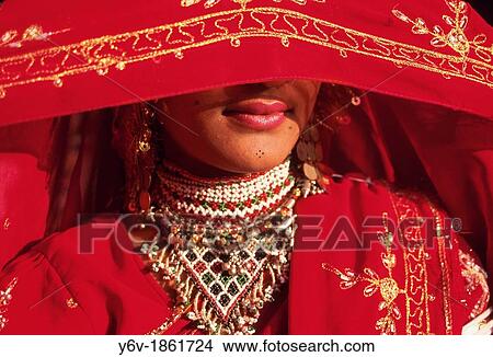 Hindu woman traditionally dressed hiding her face. Rajasthan, India. View Large Photo Image Picture - Hindu woman traditionally dressed hiding her face. Rajasthan, India.. Fotosearch