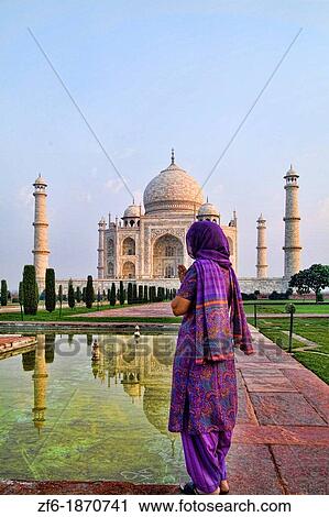 Hindu woman with colorful sari veil in the quiet peaceful Taj Mahal one of the wonders of the world in Agra India View Large Photo Image Stock Image - Hindu woman with colorful sari veil in the quiet peaceful Taj Mahal one of the wonders of the world in Agra India. Fotosearch