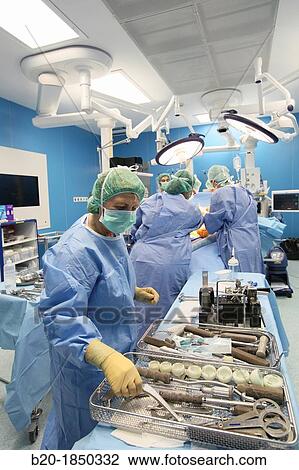 Stock Image - Hip replacement surgery, Orthopedics and Trauma surgery, Surgeon, Operating Theatre, Donostia Hospital, San Sebastian, Donostia, Gipuzkoa, Basque Country, Spain. Fotosearch