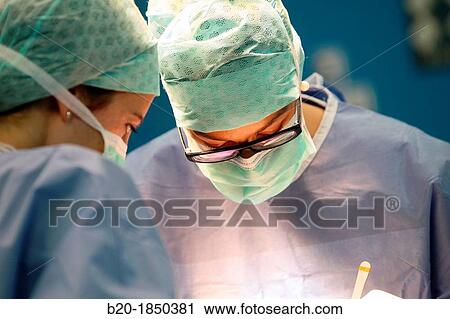 Stock Image - Hip replacement surgery, Orthopedics and Trauma surgery, Surgeon, Operating Theatre, Donostia Hospital, San Sebastian, Donostia, Gipuzkoa, Basque Country, Spain. Fotosearch