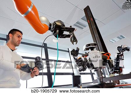 Stock Photo - HIRO robot, Humanoid robot for automotive assembly tasks in collaboration with people and and LWR robot, using haptic teleoperation with force feedback. Fotosearch
