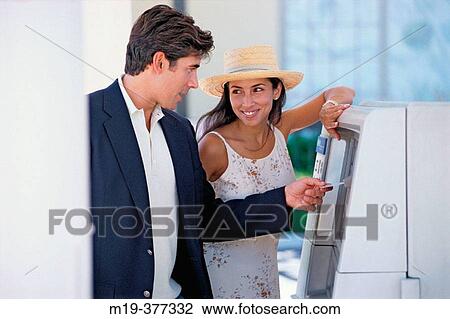 hisp couple at a bank teller machine View Large Photo Image Stock Image - hisp couple at a bank teller machine. Fotosearch