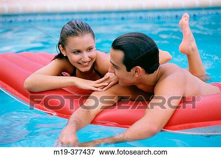 hisp couple in a swiming pool View Large Photo Image Stock Photo - hisp couple in a swiming pool. Fotosearch