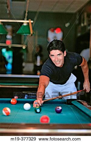 hisp man shooting pool View Large Photo Image Stock Photo - hisp man shooting pool. Fotosearch