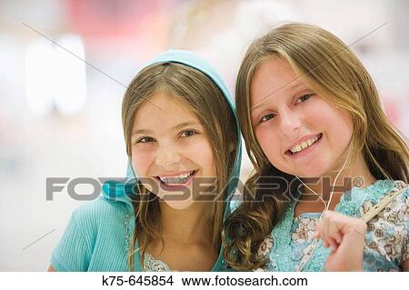 hispanic and caucasian, age 10, best friends, portrait, smilig, ear buds, hoodie View Large Photo Image Picture - hispanic and caucasian, age 10, best friends, portrait, smilig, ear buds, hoodie. Fotosearch