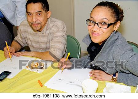 Hispanic art class students receiving sketching lessons at the East Harlem Spanish Manhattan Seventh Day Adventist Church, Manhattan, New York City, USA. View Large Photo Image Stock Photo - Hispanic art class students receiving sketching lessons at the East Harlem Spanish Manhattan Seventh Day Adventist Church, Manhattan, New York City, USA.. Fotosearch
