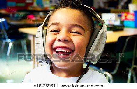 Hispanic boy at computer in school View Large Photo Image Stock Image - Hispanic boy at computer in school. Fotosearch