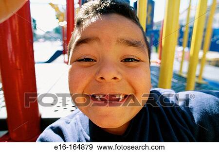 Hispanic boy missing teeth View Large Photo Image Stock Photo - Hispanic boy missing teeth. Fotosearch