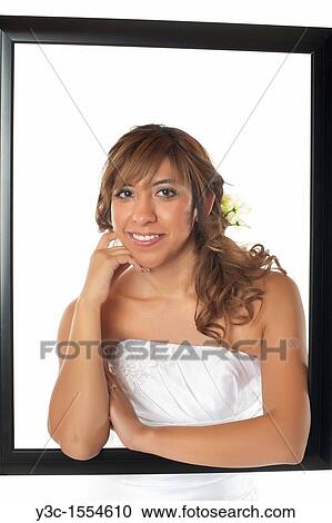 Stock Image - Hispanic bride with bridal flower bouquet. Fotosearch