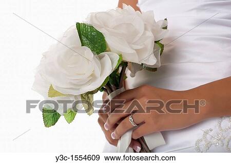 Hispanic bride with bridal flower bouquet View Large Photo Image Stock Photo - Hispanic bride with bridal flower bouquet. Fotosearch