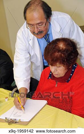 Hispanic elderly woman receiving sketching lessons at the East Harlem Spanish Manhattan Seventh Day Adventist Church, East Harlem, Manhattan, New York City, USA. View Large Photo Image Stock Image - Hispanic elderly woman receiving sketching lessons at the East Harlem Spanish Manhattan Seventh Day Adventist Church, East Harlem, Manhattan, New York City, USA.. Fotosearch