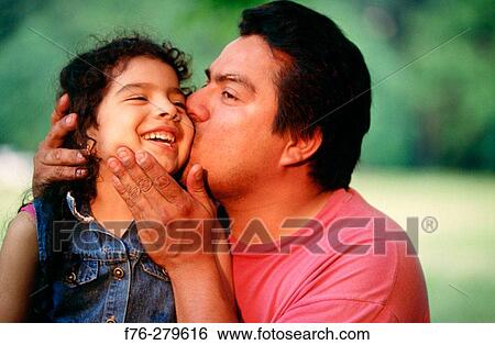 Stock Photograph - Hispanic father with daughter. Chelsea. Massachusetts. USA. Fotosearch