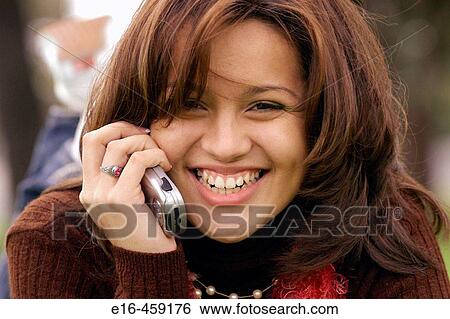 Hispanic girl on phone View Large Photo Image Stock Photograph - Hispanic girl on phone. Fotosearch