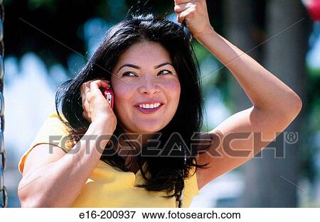 Hispanic lady on telephone View Large Photo Image Stock Photo - Hispanic lady on telephone. Fotosearch