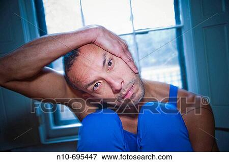 Hispanic man posing in front of a window. View Large Photo Image Stock Photo - Hispanic man posing in front of a window.. Fotosearch