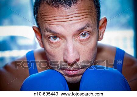 Hispanic man posing in front of a window. View Large Photo Image Stock Photo - Hispanic man posing in front of a window.. Fotosearch