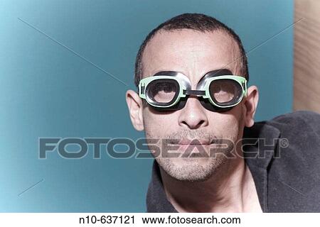 Hispanic man, wearing goggles, posing View Large Photo Image Stock Image - Hispanic man, wearing goggles, posing. Fotosearch