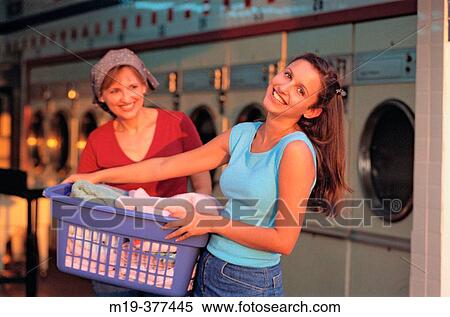 hispanic mother and daughter do laundry together View Large Photo Image Stock Photography - hispanic mother and daughter do laundry together. Fotosearch