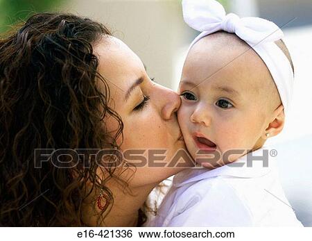 Hispanic mother kissing baby View Large Photo Image Stock Photograph - Hispanic mother kissing baby. Fotosearch