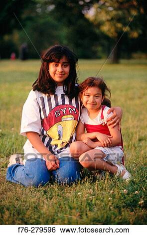 Hispanic sisters View Large Photo Image Stock Photograph - Hispanic sisters. Fotosearch