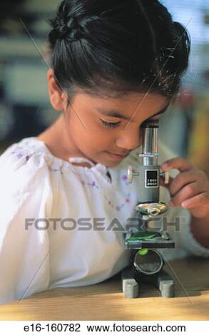 Hispanic student looking through microscope View Large Photo Image Stock Image - Hispanic student looking through microscope. Fotosearch