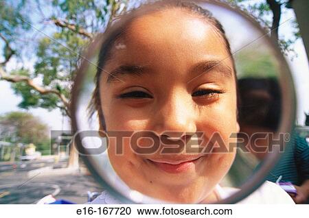 Hispanic student looking through magnifying glass View Large Photo Image Stock Image - Hispanic student looking through magnifying glass. Fotosearch