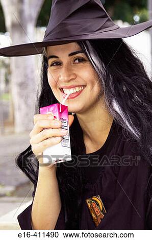 Hispanic Woman drinking juice in witch costume View Large Photo Image Stock Image - Hispanic Woman drinking juice in witch costume. Fotosearch