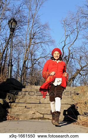 Stock Image - Hispanic woman in park. Fotosearch