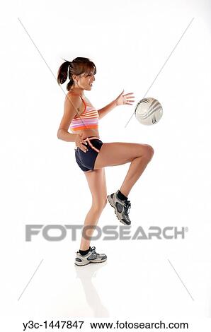 Hispanic woman juggling soccer ball View Large Photo Image Stock Photo - Hispanic woman juggling soccer ball. Fotosearch