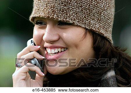 Hispanic woman on phone View Large Photo Image Stock Photography - Hispanic woman on phone. Fotosearch