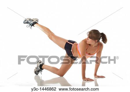 Hispanic woman stretching at fitness exercise View Large Photo Image Stock Image - Hispanic woman stretching at fitness exercise. Fotosearch
