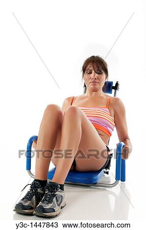 Hispanic woman using abs training device View Large Photo Image Stock Image - Hispanic woman using abs training device. Fotosearch