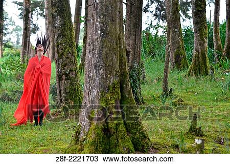 Hispanic woman with a red cloak, recreating a modern fairy tale of Little Red Riding Hood. View Large Photo Image Stock Image - Hispanic woman with a red cloak, recreating a modern fairy tale of Little Red Riding Hood.. Fotosearch