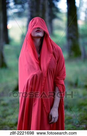 Hispanic woman with a red cloak, recreating a modern fairy tale of Little Red Riding Hood. View Large Photo Image Stock Photo - Hispanic woman with a red cloak, recreating a modern fairy tale of Little Red Riding Hood.. Fotosearch