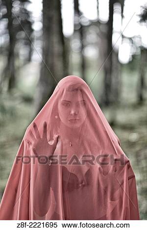 Hispanic woman with a red cloak, recreating a modern fairy tale of Little Red Riding Hood. View Large Photo Image Stock Photography - Hispanic woman with a red cloak, recreating a modern fairy tale of Little Red Riding Hood.. Fotosearch