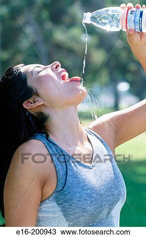 Hispanic women drinking after workout View Large Photo Image Stock Image - Hispanic women drinking after workout. Fotosearch