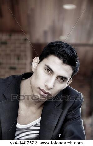 Hispanic young male posing at park View Large Photo Image Stock Image - Hispanic young male posing at park. Fotosearch