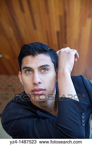 Hispanic young male posing at park View Large Photo Image Stock Image - Hispanic young male posing at park. Fotosearch