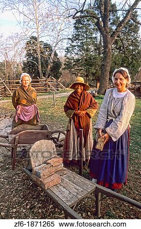 Historical Colonial America in Williamsburg Virginia with female actors acting out history in costume View Large Photo Image Stock Photography - Historical Colonial America in Williamsburg Virginia with female actors acting out history in costume. Fotosearch