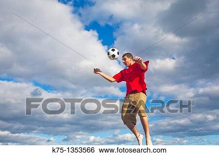Hitting soccer ball View Large Photo Image Stock Photograph - Hitting soccer ball. Fotosearch