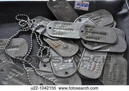 Stock Photography - Ho Chi Min City (Vietnam): military identity discs sold as souvenirs at the War Remnants Museum. Fotosearch